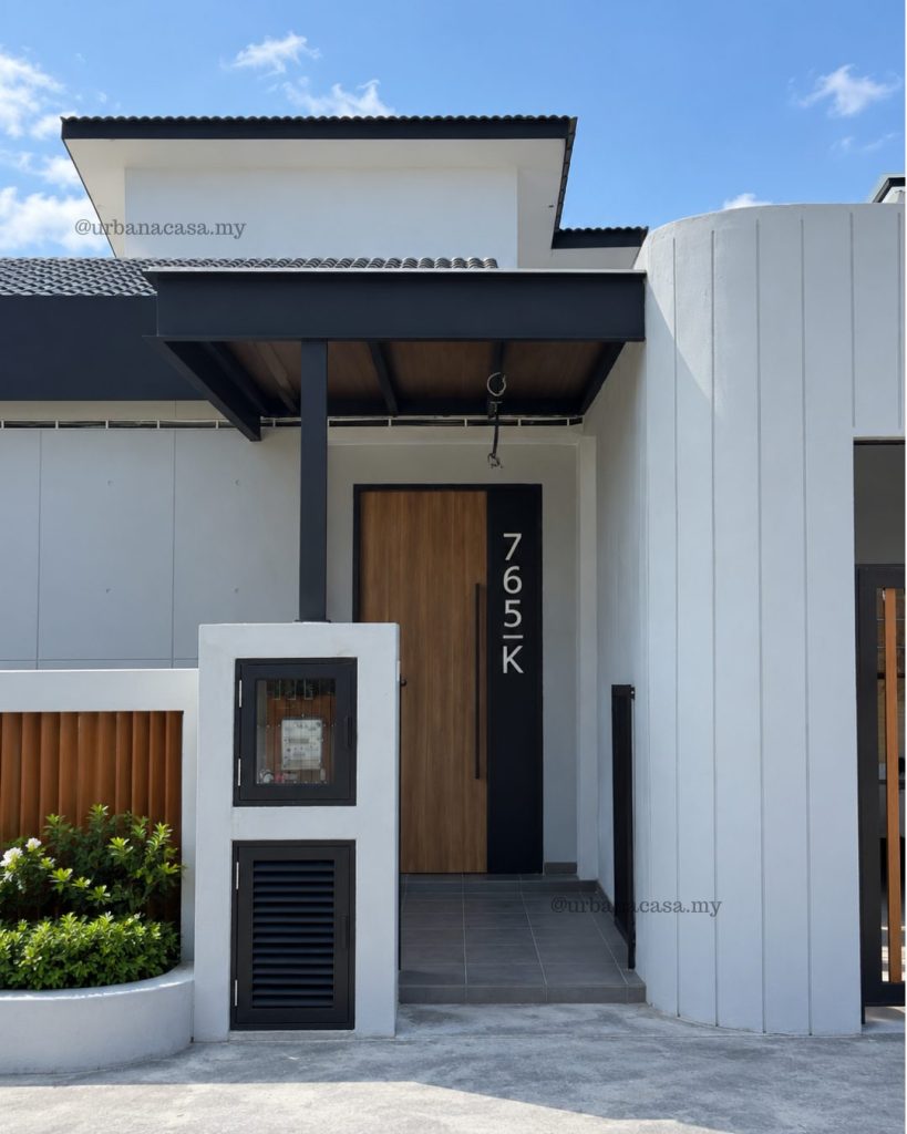 Home renovation in Melaka: modern house with a curved white facade by Urban Acasa