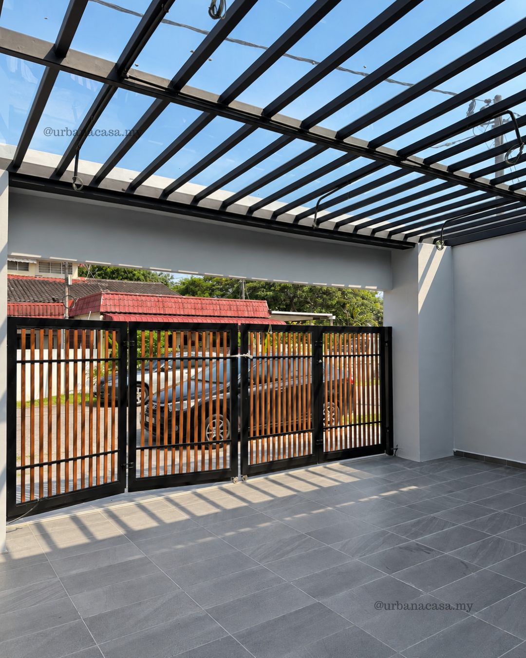 Car porch with black steel pergola and grey floor tiles