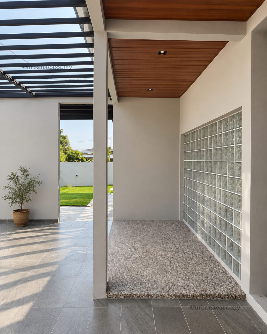 Entrance foyer with glass block wall and timber ceiling