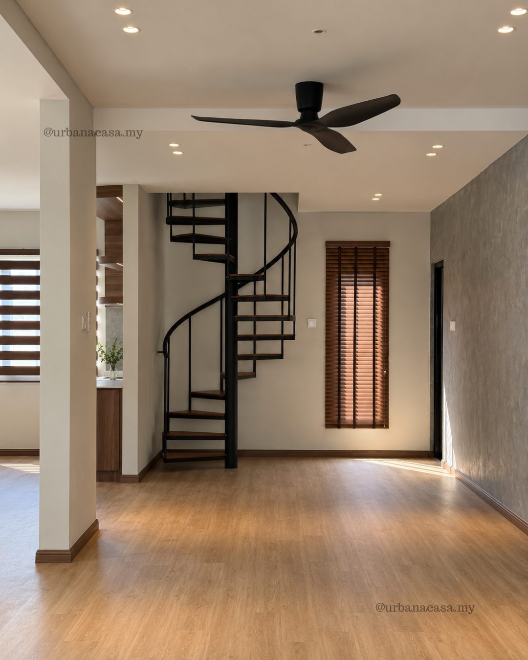 Black spiral staircase in the open living space